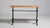 A traditional French early 20th century cast iron bistro table with clean proportions and a solid iron base, representing...