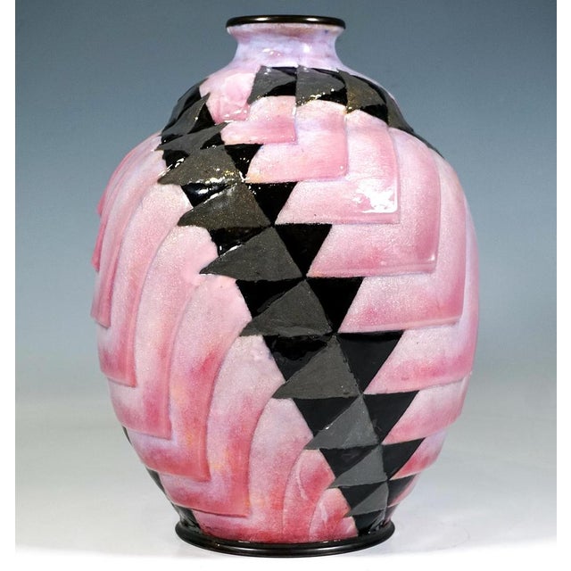 Large ovoid copper vessel on a round, grooved base with a short, narrow neck constriction and flared rim, coated in...