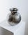 This vintage Italian vase from the 1960s is a beautifully decorative example of handcrafted metalwork. Made from brass...
