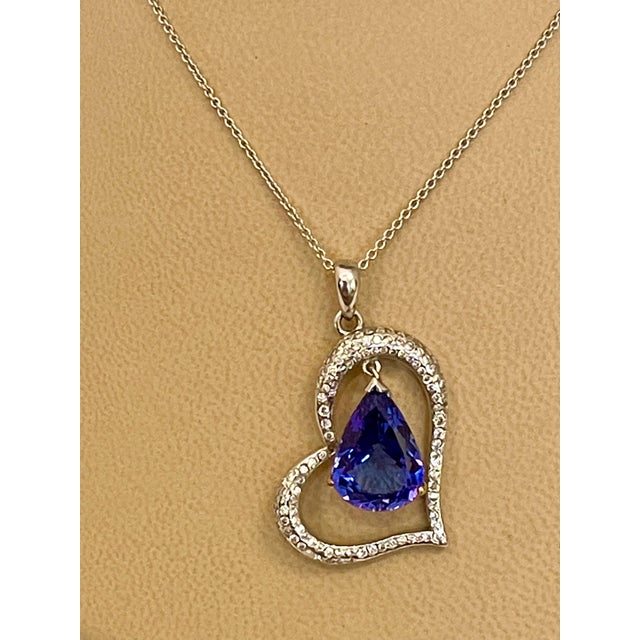 Fix the ct weight and make the listing, only pictures are loaded 3 carats of fine quality of Tanzanite pendant surrounded...