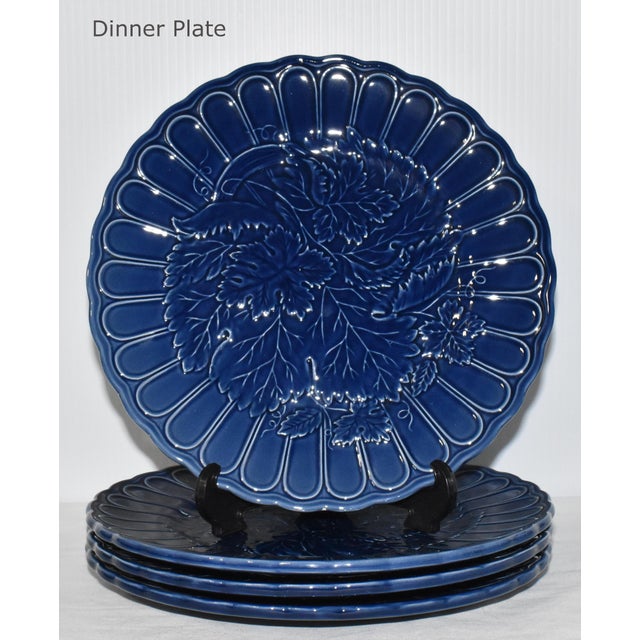 Nice vintage porcelain dinnerware set with floral leaf pattern. The contrasting colors pair beautifully together to create...