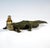 Serpentine crocodile with head raised to the side and mouth wide open, with removable back section and recessed, removable...