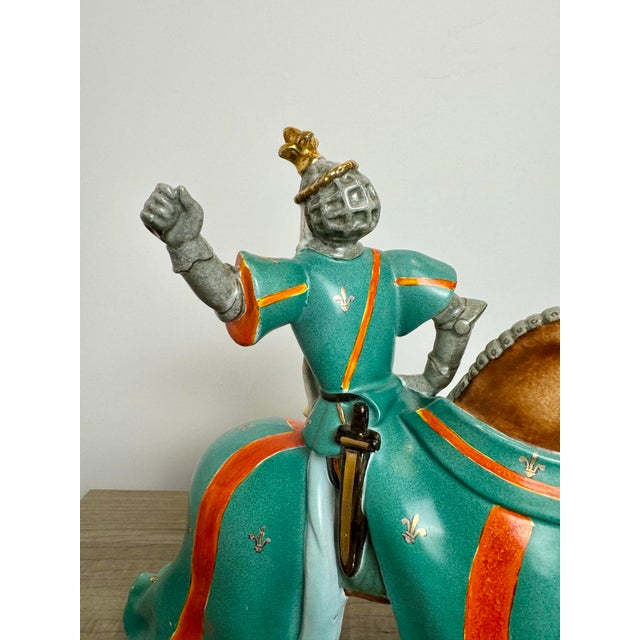 A striking mid-century Italian ceramic sculpture depicting a medieval knight on horseback, attributed to renowned...