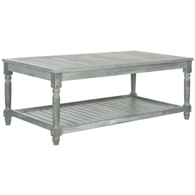 Designed to evoke the charm of coastal cottage style, the outdoor coffee table combines form and function. Crafted of...