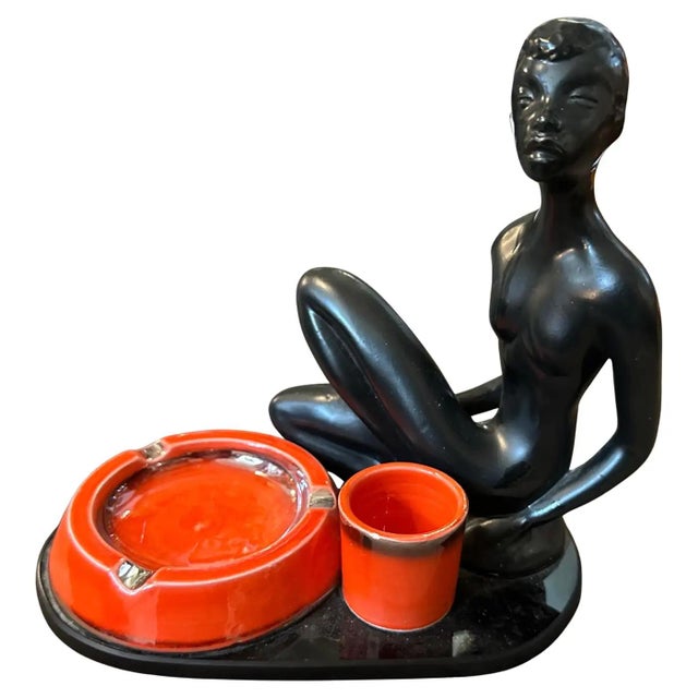 This is a striking mid-century modern Italian smoking set, combining black glass and ceramic elements with bold design....