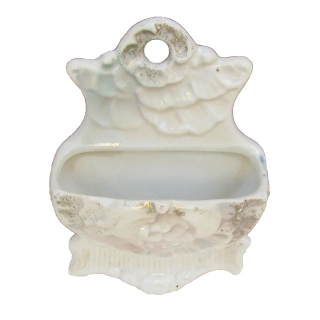 Vintage pearlescent / lustreware wall mounted match keeper / match strike. Fabricated of porcelain with a luminous white...