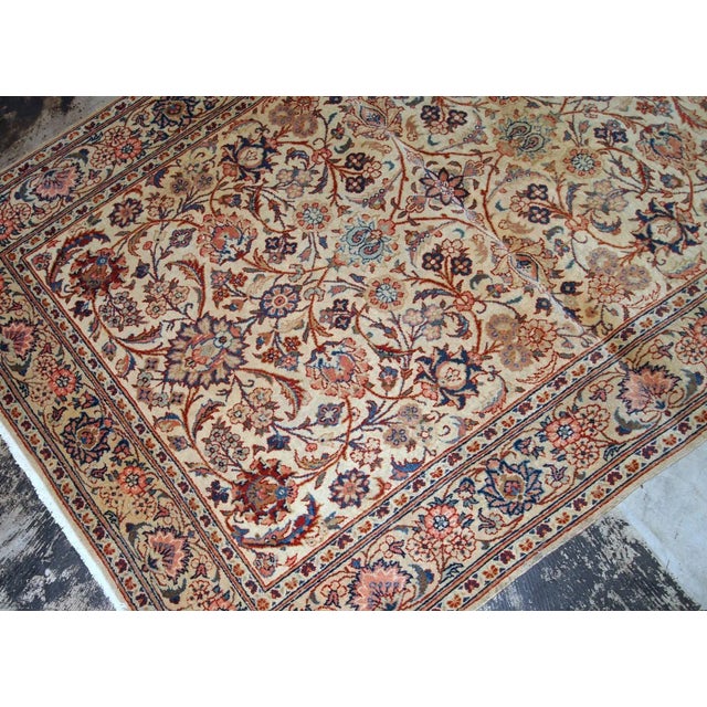 Handmade antique Kashan rug in light shade of beige. The rug is in original good condition from the beginning of 20th...