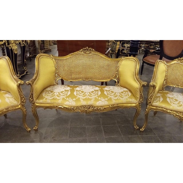 A beautiful 3-piece French Louis XV-style salon set consisting of one settee and two matching fauteuil armchairs,...