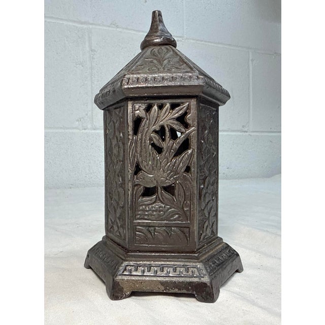 Up for sale is an antique 1890's Chamberlain & Hill Victorian cast iron lantern/ space heater still bank. This unique...
