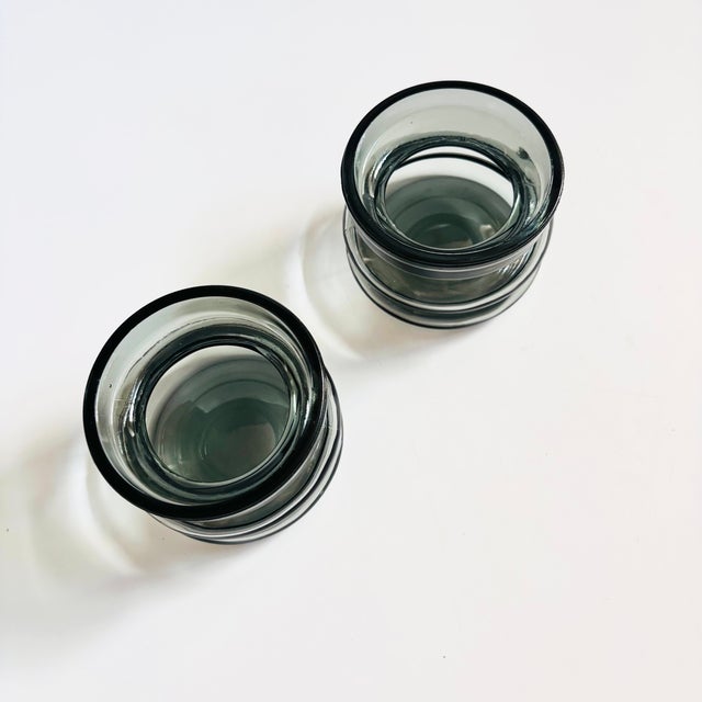 A set of 2 mid century hooped glass tealight candle holders. Lovely gray color to the glass. Made in England by Cascade.