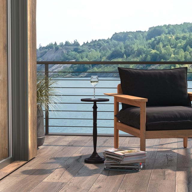 Elevate your outdoor space with the Butler Specialty Company Landon round pedestal end table. Expertly crafted from...