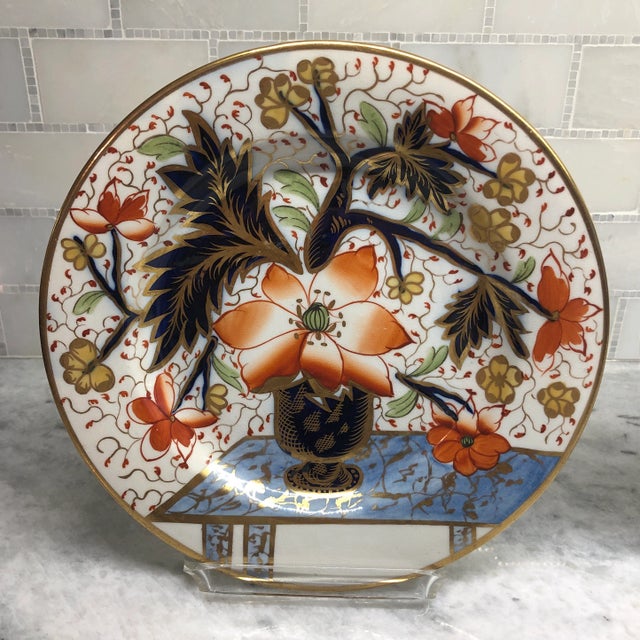 Beautiful pair of antique English Davenport porcelain plates. Unusual hand painted stylised floral design in cobalt blue...