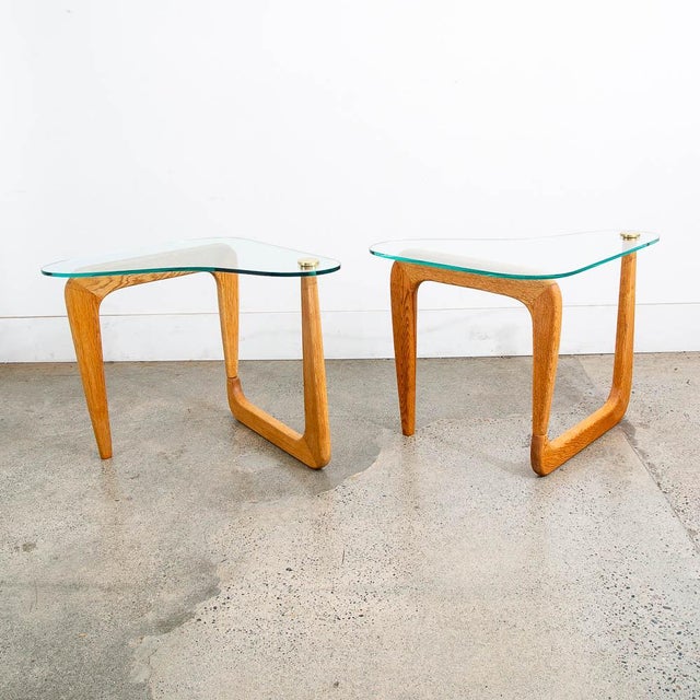 Unique set of Noguchi style end tables with glass and brass trim. Unique and well made. The white oak frames have been...