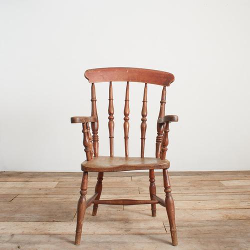 A charming traditional windsor stick back spindle kitchen carver chair with solid elm seat, raised on turned ash supports...