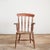 A charming traditional windsor stick back spindle kitchen carver chair with solid elm seat, raised on turned ash supports...