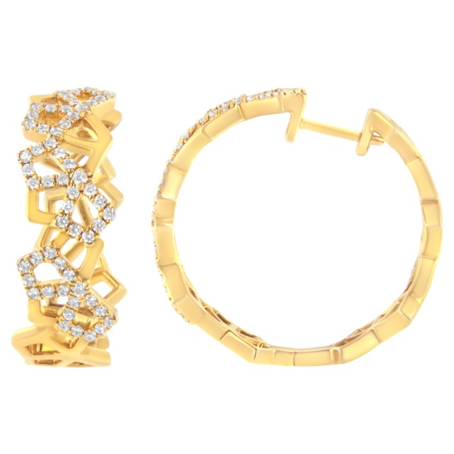 Indulge in the opulence of these 14K yellow gold hoop earrings, where luxury meets geometric elegance. Each piece parades...