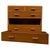 A handsome vintage 20th-century English chest of drawers, finely crafted from golden oak and distinguished by its...