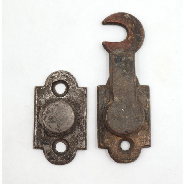 Classic style window shutter latch made of nickel plated brass with arch shaped back plates. The original mounting screws...