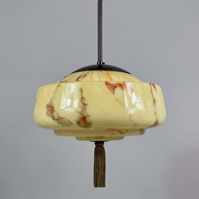 This elegant pendant was designed and manufactured in Germany in the 1930s during the Bauhaus era. The light features a...