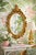 Elevate your space with this vintage gold wall mirror, crafted in the Syroco wood style and featuring an elaborate...