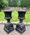 A substantial pair of English cast iron garden urns on their original square plinths, dating to circa 1880. Of classic...