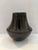 Signed Santa Clara Pueblo black pottery vase by acclaimed Native American potter Madeline Tafoya (1912–2002). This elegant...