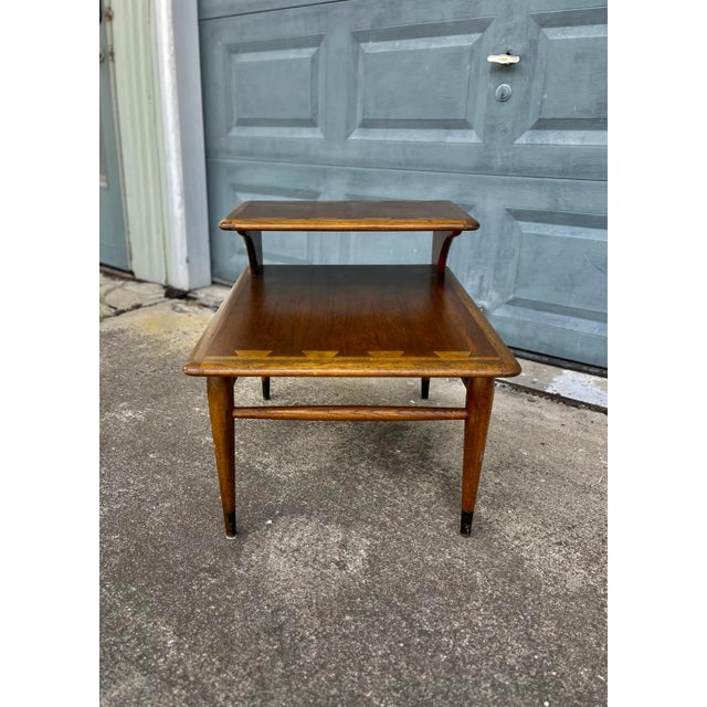 Mid-century modern two-tiered side table, Acclaim series by Lane Furniture. . Classic mid-century side table by Lane. With...