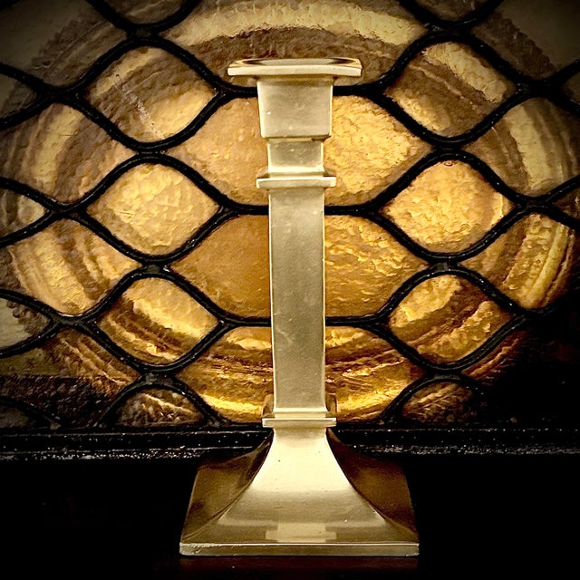 This Vintage Brass Statuesque Candlestick Holder heavy solid brass candlestick blends midcentury modernism with a...