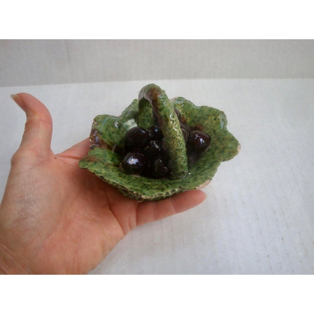 Very special rustic European small scale antique majolica piece with a cabbage, fig, or grape leaf basket stacked with...