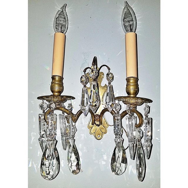 A lovely antique French hand-rubbed gold plated-doré bronze and cut-crystal sconces. Wired and in working condition, takes...