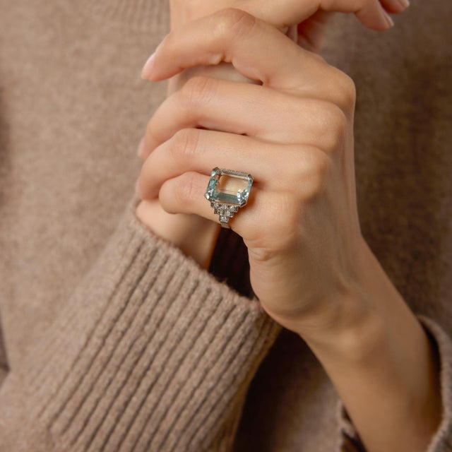 A breathtaking statement from the height of the Art Deco era, this 1930s cocktail ring centers on a magnificent 9.90 carat...