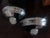 A pair of wall Etruscan sconces designed and manufactured by Karl Springer, circa 1970s. Made of chromed steel with opaque...