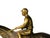 A French Jockey à Cheval tabletop sculpture from the Napoleon III period crafted in gilt and patinated bronze, depicting a...