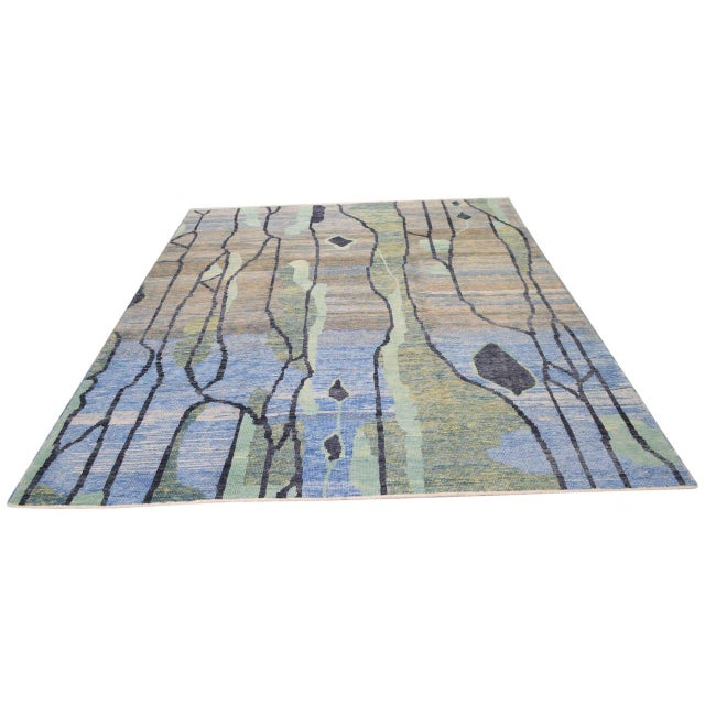 Hand-knotted with care using traditional rug-making techniques, this wool rug blends timeless craftsmanship with a modern...