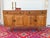 A fantastic vintage Danish oak sideboard attributed to Henning Kjærnulf, blending Scandinavian functionality with the...