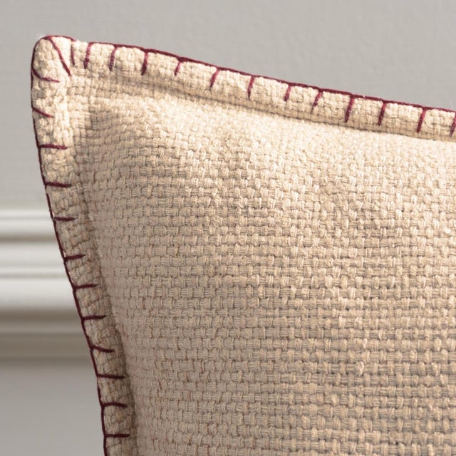 Introducing the Rhea Pillow in an appealing natural hue with brown accents. This pillow will seamlessly blend with a...