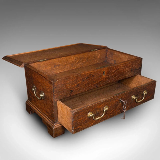 This is an antique apprentice mule chest. An English, oak miniature desktop coffer, dating to the late Georgian period,...