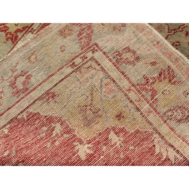 Mid 20th Century Mid 20th Century Red Field Vintage Turkish Oushak Rug With Geometric Medallion and Floral Motifs For Sale In Atlanta - Image 6 of 7