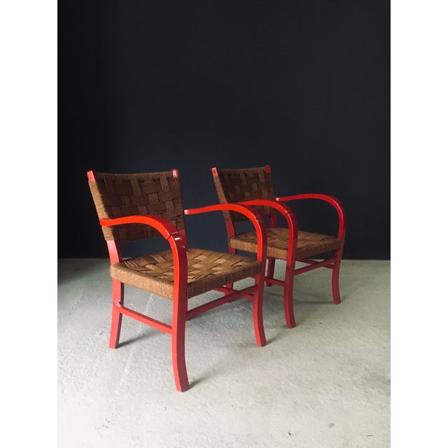 Vintage Mediterranean Design Arm Chair Set 2. Made in France, 1950's period. Red lacquered beech frame with woven rope...