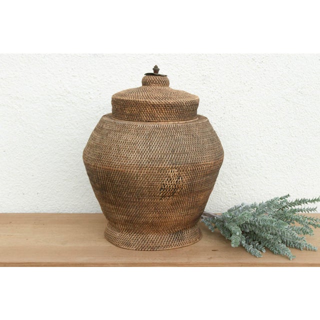 A beautiful example of finding beauty in imperfection, this antique lidded basket features an exceptionally tight,...