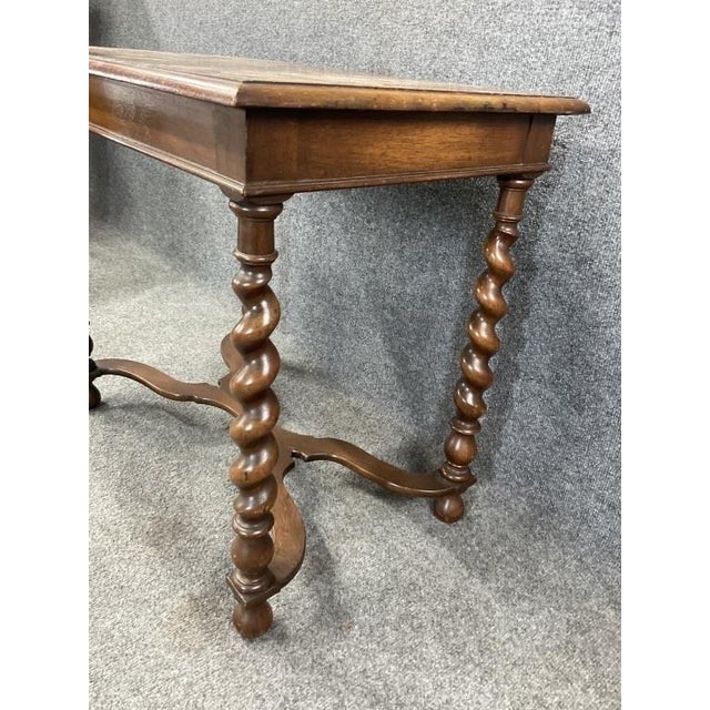 Antique English barley twist entry table featuring beautifully turned spiral legs and a classic stretcher base. This...