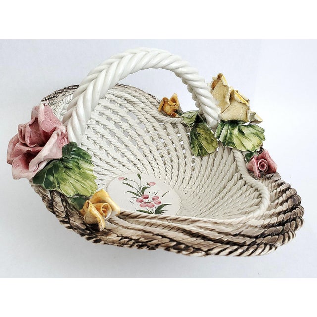Offering a large vintage Italian hand painted porcelain spaghetti-ware centerpiece bowl, circa 1960s. It is signed on...