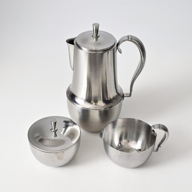 Given dimensions are for the coffee pot. creamer: h 8 cm, w 12 cm, d 9 cm. sugar bowl: h 9 cm, dia 9.5 cm