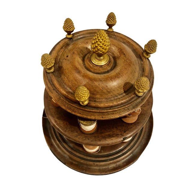 A 19th century French empire thread holder with bronze doré finials in an elegant near classical form. Most of the thread...