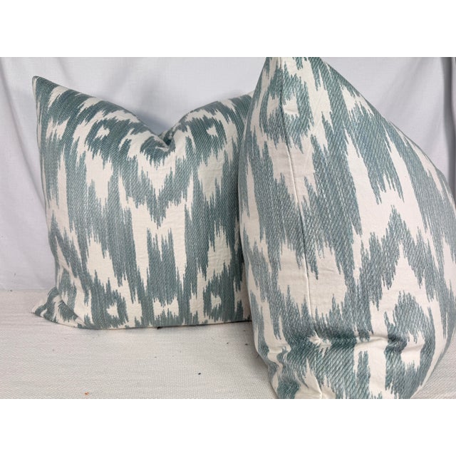 Custom pair of 22" pillows covered in Schumacher "Dorset" embroidered fabric in color mineral. These pillows have tapered...