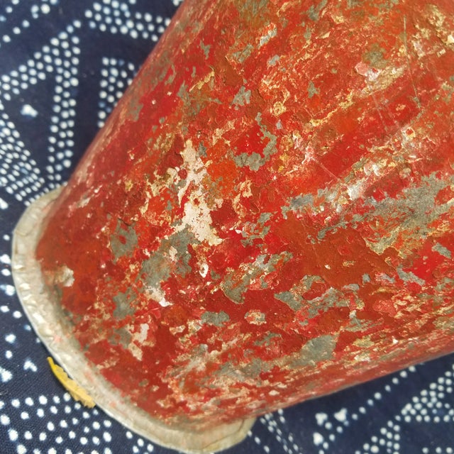 A great old metal chippy paint wall bucket with 6 hand painted chipati rolling pins. hand painted on wood.