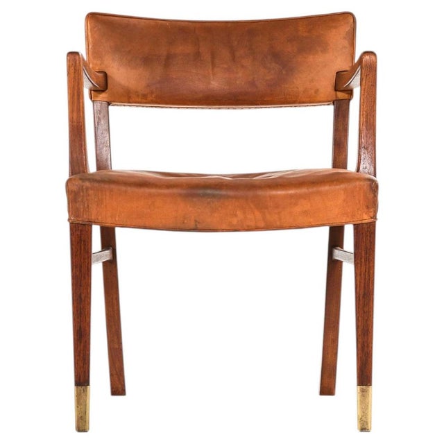 This rare armchair, attributed to ernst kühn and produced by lysberg, hansen & therp in denmark during the 1940s, is a...