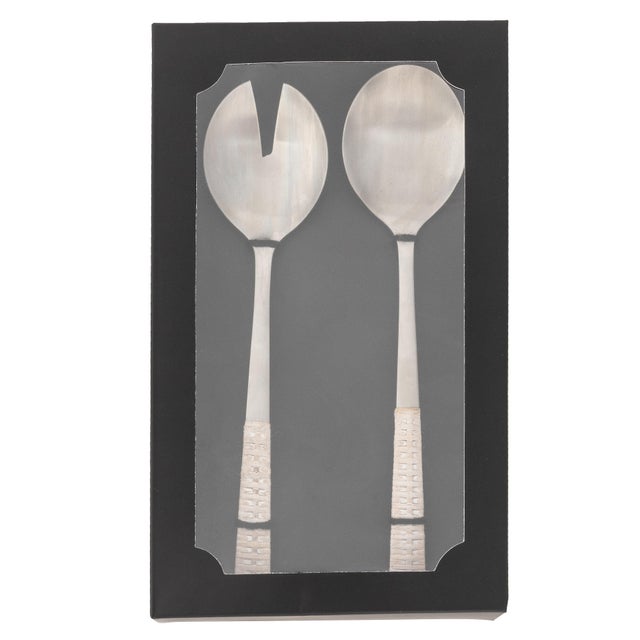 Elevate your dinner parties with the Rattan Stainless Steel Serving Pieces (Set of 2). This stunning set includes a...