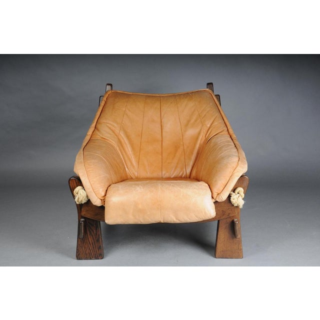 Maison regain lounge chairs, leather, oak, france, 1960s 1960s french pair of maison regain leather chairs. Camel-colored...