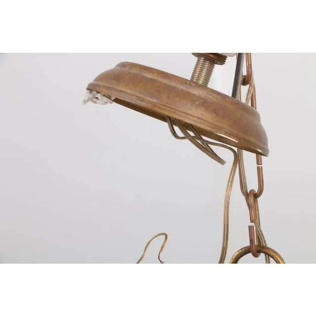 A 20th century French gilt bronze three light hall lantern. The antique lantern has five panels, four with the original...